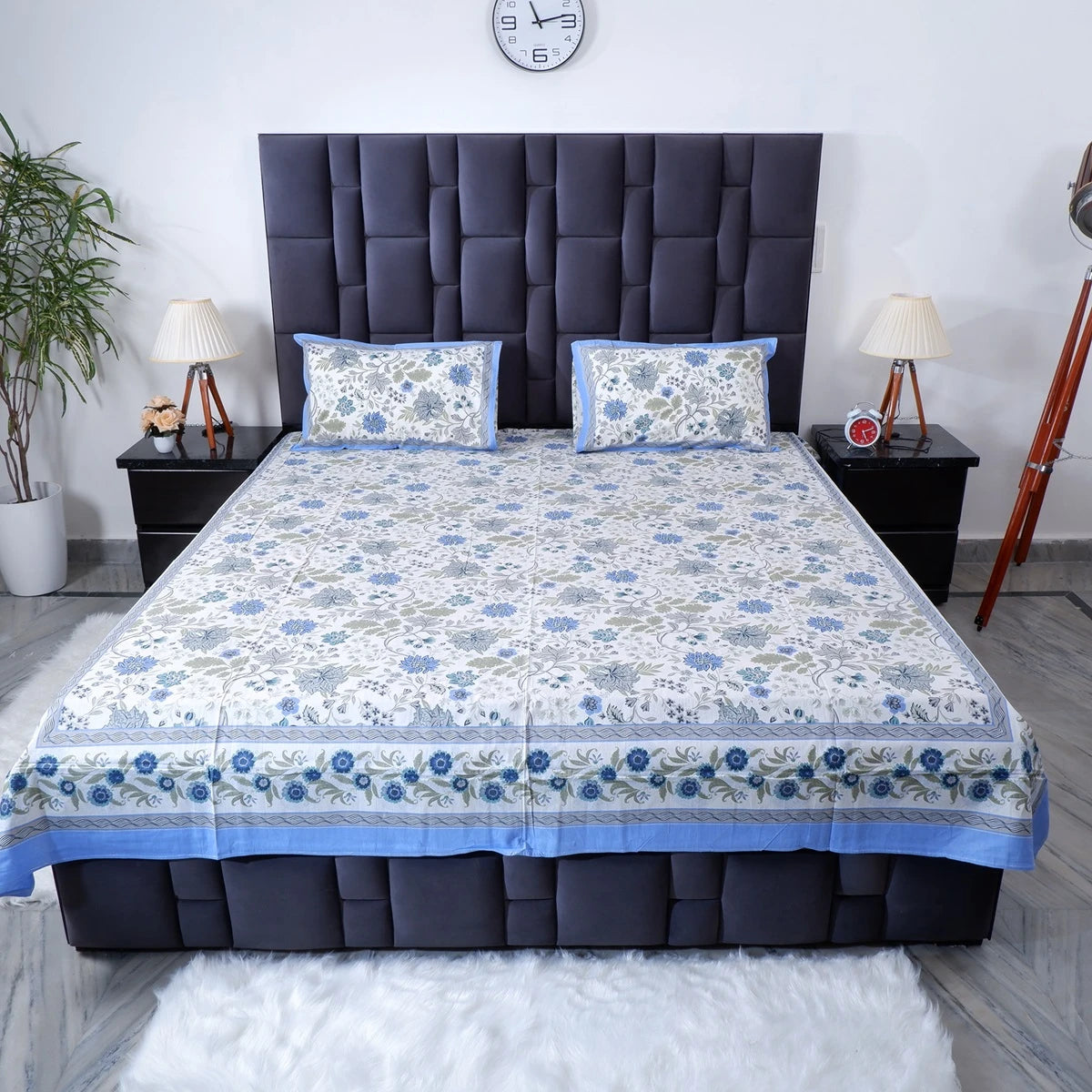 Pure cotton bed sheet set with floral design and matching pillow covers on a modern bed